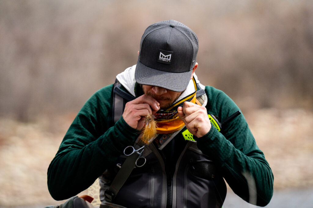 Tying a fly at a Fishing The Good Fight Retreat.